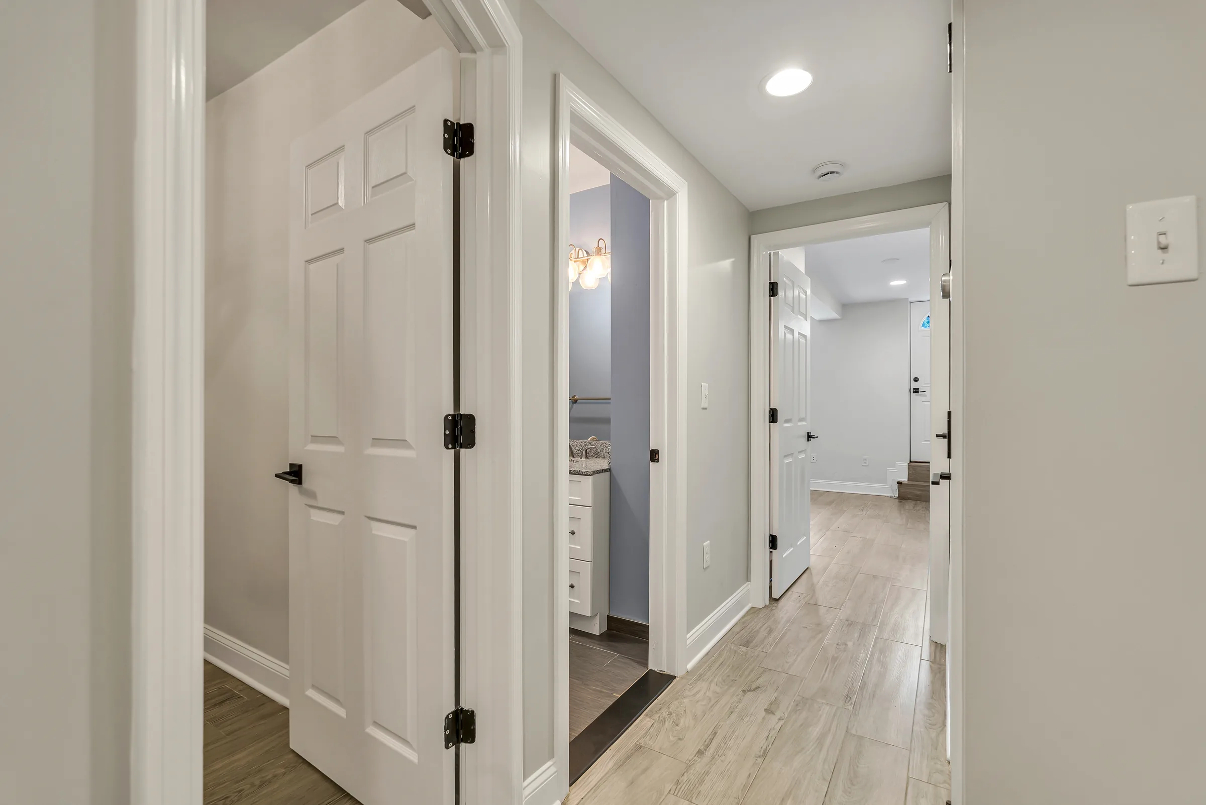 Hallway looking toward the patio door at Apartment B, 829 Garden Street.