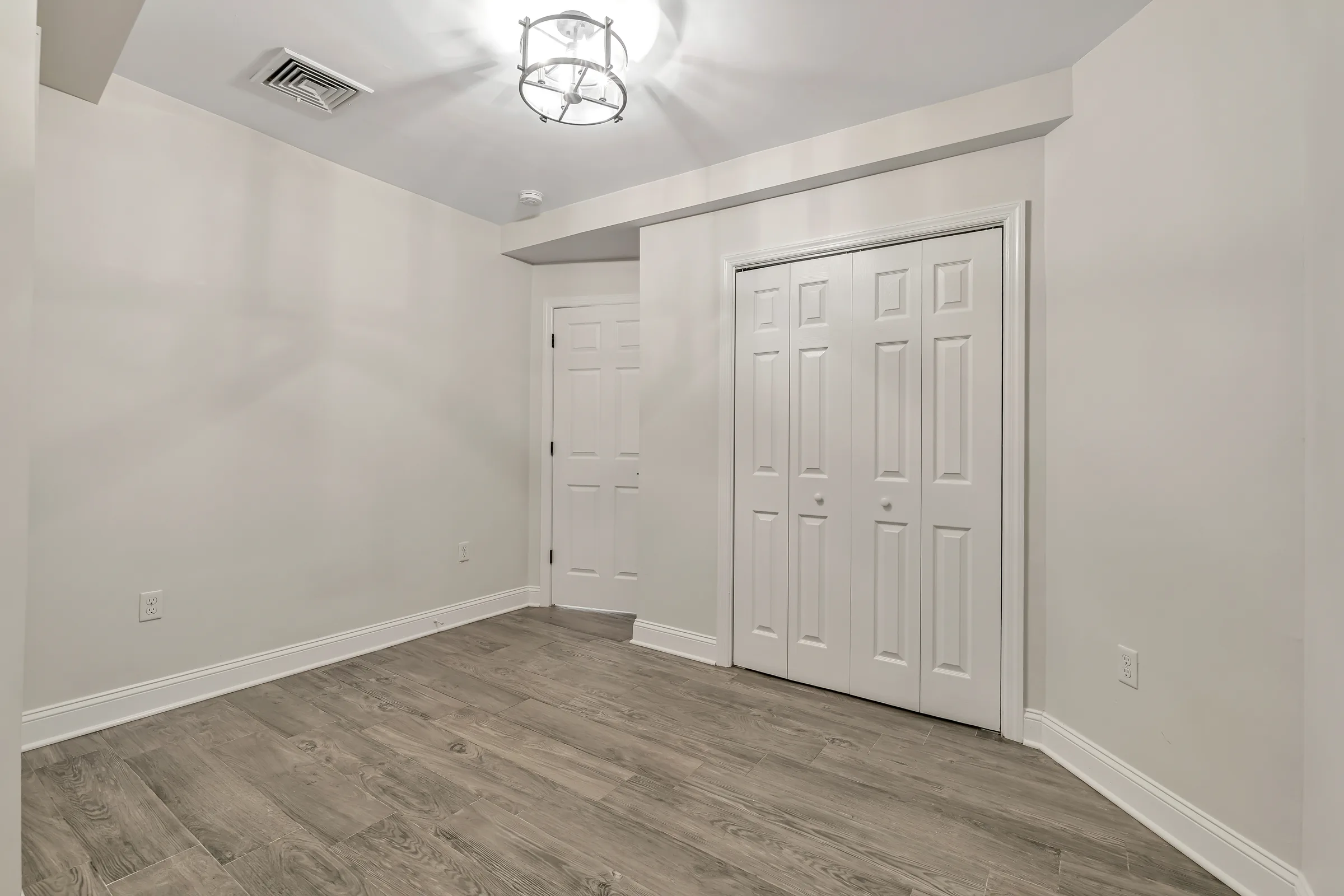 Closet doors in the second bedroom at Apartment B, 829 Garden Street.