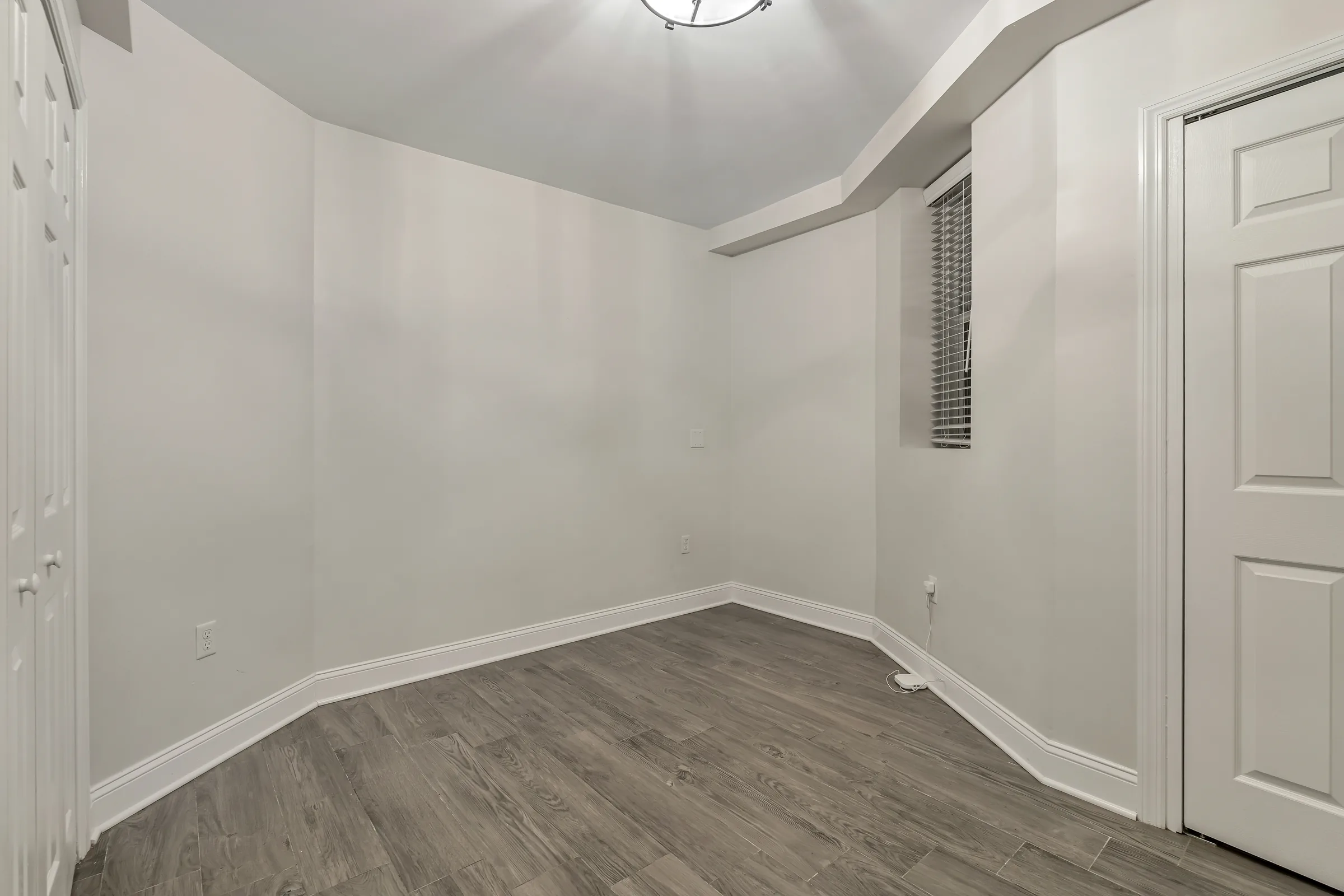 Second bedroom with a window at the garden apartment, 829 Garden Street, Uptown Hoboken.