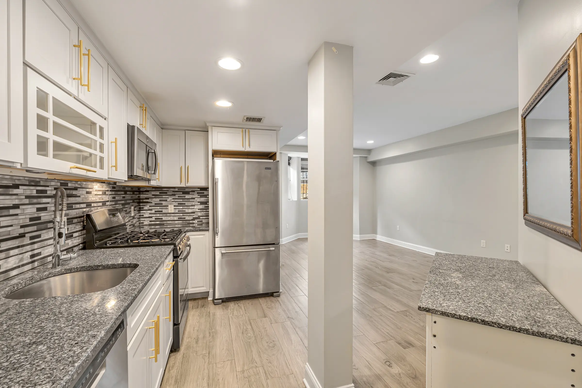 Kitchen opening into the living room at Apartment B, 829 Garden Street.